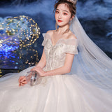 One-Word Shoulder Wedding Dress 2026 New Temperament Bride Simple Atmospheric Princess Dress Small Tug Tail Thin Wedding Dress HZ0517