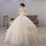 Light Wedding Dress 2026 New Breast-Meared Ponbo Skirt Super Fairy Champagne Dress Femininity Princess Femininity Princess Wedding Dress HZ0517