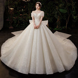 One-Word Shoulder French Light Wedding Dress 2026 New Temperament Big Tail Princess Style Bridal Dress Simple Atmosphere HZ0517