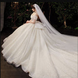 One-Word Shoulder French Light Wedding Dress 2026 New Temperament Big Tail Princess Style Bridal Dress Simple Atmosphere HZ0517
