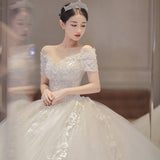 Light Wedding Dress 2026 New Word Shoulder Bridal Thin Short Sleeves Drag-Tailed Temperament Princess Mori Wedding Dress HZ0517