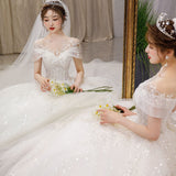One-Word Shoulder-To-Shoulder Wedding Dress 2026 New Main Yarn Bride Spring French Female Drag Tail Court Wind Trip Wedding Dress HZ0517