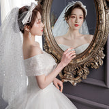 One-Word Shoulder Wedding Dress 2026 New Bride Tailed Temperament White Hebi-Style Small Man To Go Out Of The Sari System HZ0517